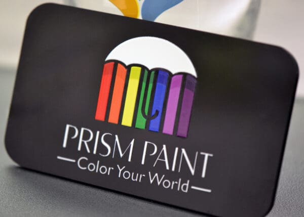 Black business card for Prism Paint.